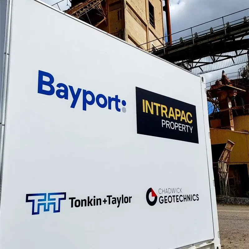 A container covered with the logos of Tonkin + Taylor, Intrapac, Bayport and Chadwick Geotechnics